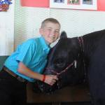Levi Breithaupt, a 10-year-old who will enter Greywolf Elementary School as a fifth -grader next year, shows his steer Frostbite at the Clallam County Fair last week. A five-year veteran of 4-H, Breithaupt has show a variety of livestock at the county fair, including chickens, turkeys and cattle. It was his first year raising steer for the junior livestock auction. I worked very hard to raise Frostbite and did all the feeding and watering on my own, Breithaupt wrote.