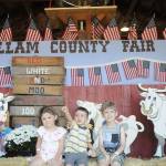 From left, Anabelle Stringham, 4, Nicky Hendrickson, 2, and Wyatt Stringham, 5, enjoy the first day of the Clallam County Fair on Aug. 14. The Stringhams are from Port Angeles; Hendrickson is from Forks. Sequim Gazette photo by Michael Dashiell