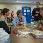 Several people from Sequim and Port Angeles work together to learn a new game at Opttacon 2019 at the Guy Cole Event Center on Aug. 17. Sequim Gazette photo by Conor Dowley