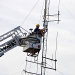 Fire officials add a 6-meter-tall radio antenna onto the radio mast on Aug. 20 to help with communications. Assistant Chief Dan Orr said the project has been in the works for a long time. Sequim Gazette photo by Matthew Nash