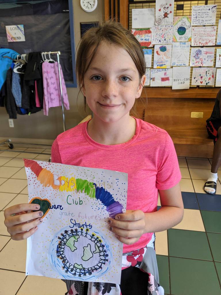 Lillian Sutherland shows off some artwork at the Sequim Boys & Girls Club last week.