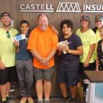 From left to right, Stephany Shackelford, James Castell, Malachi Williams, Phil Castell, Saul Williams, Kelsey Sands, Andrea Wellman and Christy Francis stand in the Castell Insurance office on Aug. 24 after their annual shred event concluded as the Williams brothers hold the money raised. The fundraiser that supports the Boys & Girls Club and their efforts to provide school supplies to students and families in need raised over $9,000 this year. Sequim Gazette photo by Conor Dowley