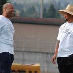 Wayne Hunter, left, shares a laugh with ex-Washington State University defensive end Logan Tago. Tago was briefly with the Seattle Seahawks this offseason after going undrafted in April, but is currently without a team and drove up from Tacoma to help with the first annual Sequim Middle School football camp. Sequim Gazette photo by Conor Dowley