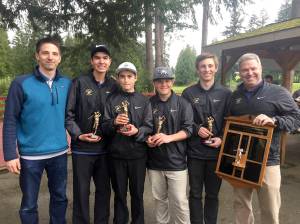 Under head coach Bill Shea (far right), the Sequim High School boys golf team celebrates defense of its title at the 51st annual Tim Higgins Memorial at Kitsap Golf and Country Club in Bremerton in 2017. Shea is stepping down from the coaching position this year after leading Sequim to four consecutive undefeated, Olympic League title-winning seasons. Pictured, from left, are assistant coach Sean OMera, Blake Wiker, Paul Jacobsen, Andrew Vanderberg, Josiah Carter and Shea. Submitted photo