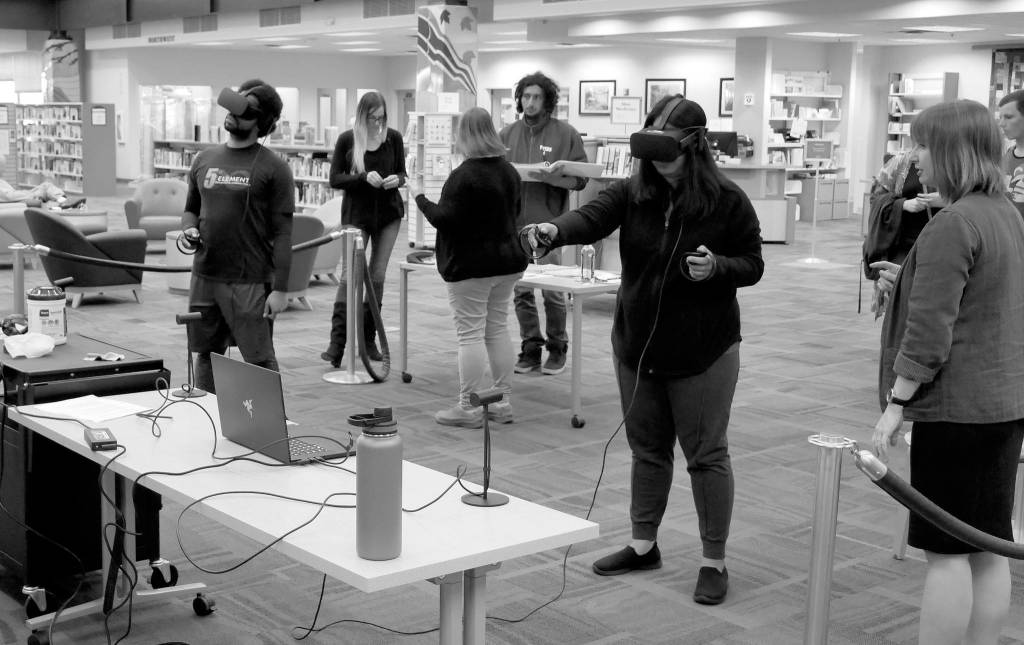 Patrons try out virtual reality (VR) devices at a recent VR session in Port Angeles. Photo courtesy of North Olympic Library System