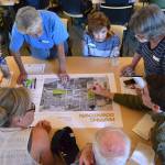 About 40 people gathered on Aug. 28 to consider options to better connect traffic and pedestrians going east-west south of West Washington Street and north of U.S. Highway 101. Some of their solutions included creating a frontage road along the highway and creating new on- and off-ramps. Sequim Gazette photo by Matthew Nash