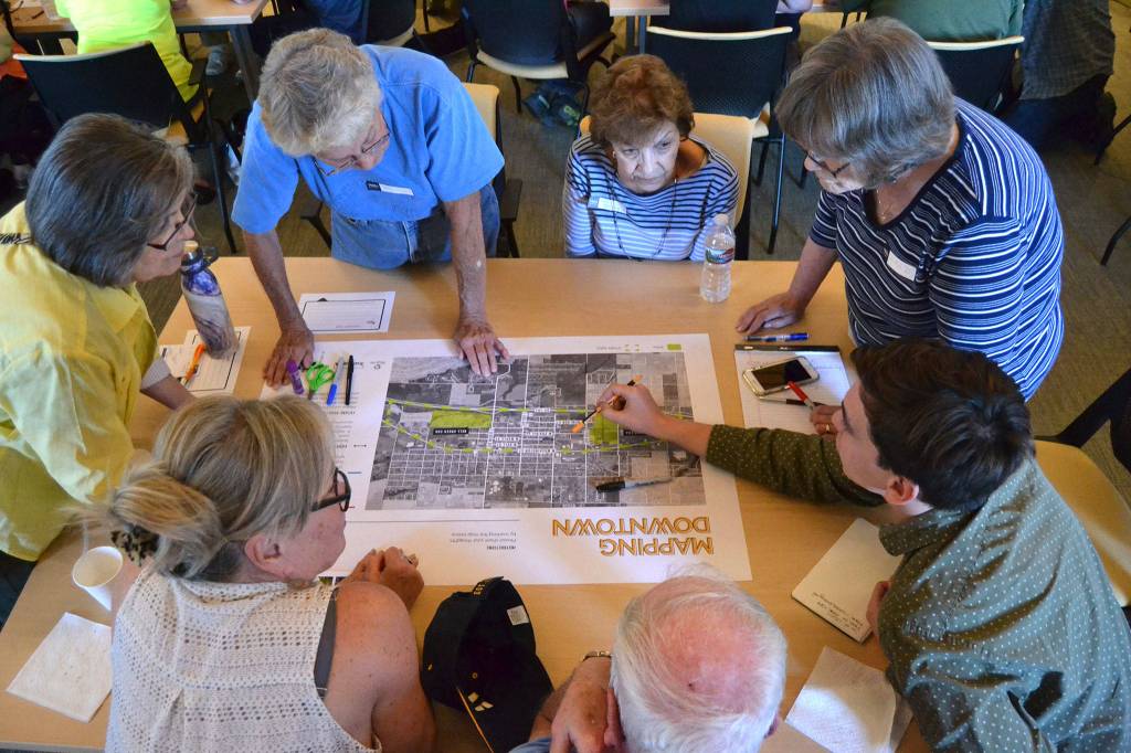 About 40 people gathered on Aug. 28 to consider options to better connect traffic and pedestrians going east-west south of West Washington Street and north of U.S. Highway 101. Some of their solutions included creating a frontage road along the highway and creating new on- and off-ramps. Sequim Gazette photo by Matthew Nash
