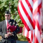 Rick McKenzie, a retired Coast Guard veteran, plays bagpipes at the 9/11 Memorial Waterfront Park during 2017 ceremonies. (Jesse Major/Peninsula Daily News)