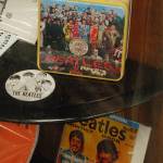 A collectable lunchbox, a fan club magazine, and a pin are among the items celebrating The Beatles on display at KSQM. Collection owner George Dooley said that the sheer scale of collectible items around the band was astounding, including things like the tie pins in the collection that quickly became difficult to find. Sequim Gazette photo by Conor Dowley