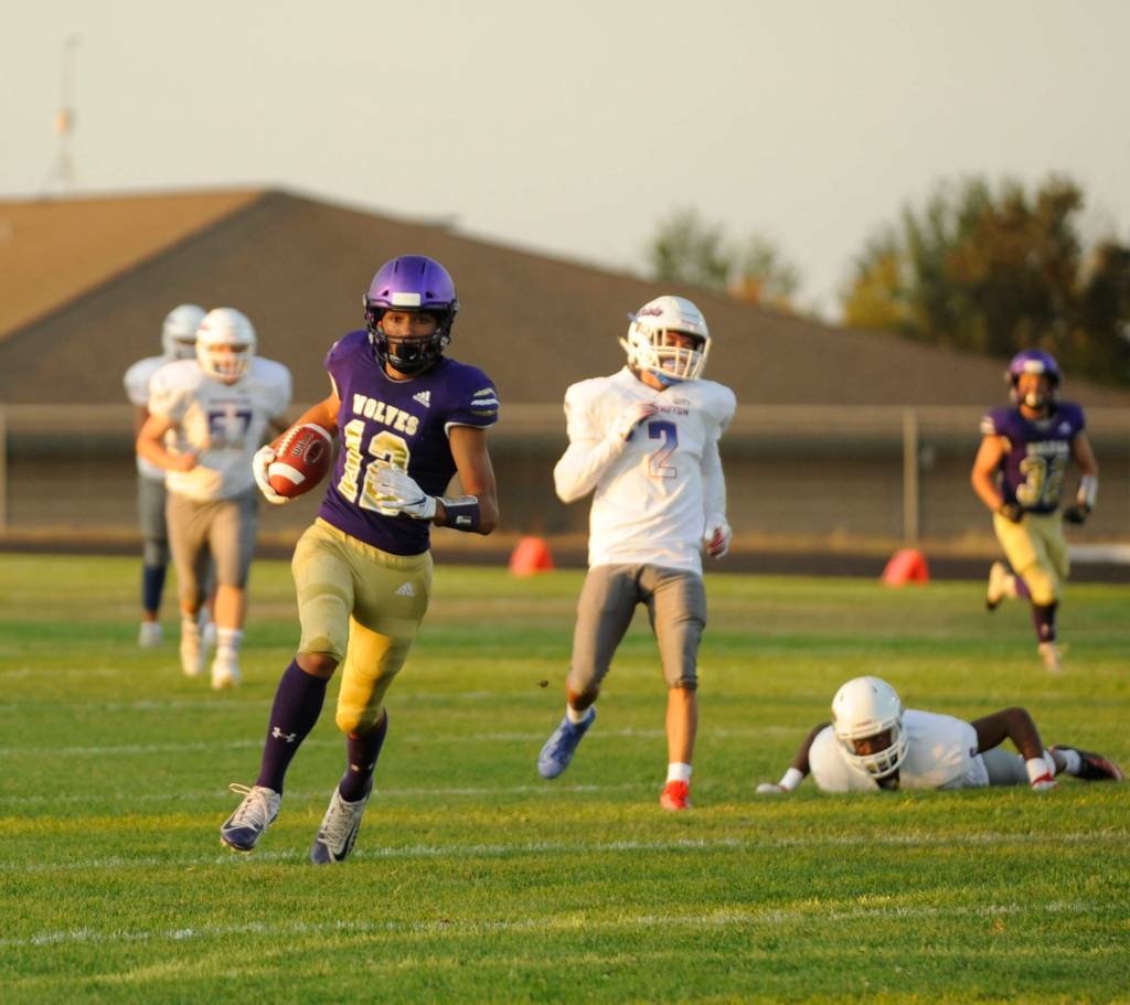 Sequim receiver Hayden Eaton snags a 45-yard touchdown pass from Taig Wiker in the second quarter of the Wolves non-league season-opener against Washington on Sept. 6. Sequim Gazette photo by Michael Dashiell
