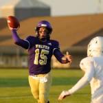 Sequim High quarterback Taig Wiker looks for a two-point conversion in the second quarter of the Wolves match-up with Washington Sept. 6. Wiker connected with Hayden Eaton on the play for the conversion and a 28-0 Sequim lead. Sequim Gazette photo by Michael Dashiell