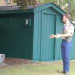 Ian Thill describes the work done to restore and enhance a storage shed at Pioneer Memorial Park for his Eagle Scout project. He said the job wound up being much more work than anticipated, with several additional structural elements of the shed getting replaced in addition to the planned roof replacement. Sequim Gazette photo by Conor Dowley