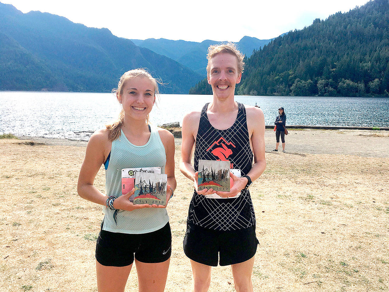 Kristina Randrup of Berkeley, Calif., and Keith Laverty of Bainbridge were the winners of the 2019 50K GOAT Run, held Saturday from Grannys Cafe to the northwestern shore of Crescent Lake. Laverty also won the 2018 Rhody Run, the 2018 North Olympic Discovery Marathon and this years NODM 10K event. Their ceramic awards were made by Gay Hunter. (Peninsula Adventure Sports)