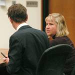 Sequim resident Michelle Ridgway, right, speaks with her advocate, Lindsey Schromen-Wawrin, at the start of Thursdays court hearing to determine the eligibility of Olympic Medical Center Commissioner District 1 candidate Anne Marie Henninger based upon Henningers residency. Ridgway filed papers Aug. 5 challenging Henningers candidacy. Photo by Keith Thorpe/Peninsula Daily News