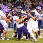 Sequim linebacker Isaiah Cowan makes a stop on Forks running back Ricardo Barragan in the first quarter of the Wolves 27-13 win at Forks on Sept. 13. Sequim Gazette photo by Michael Dashiell