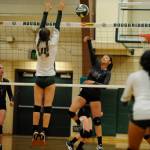 Sequims Kiana Robideau hits past Port Angeles Zoe Smithson in an Olympic League match-up on Sept. 12. Sequim Gazette photo by Michael Dashiell