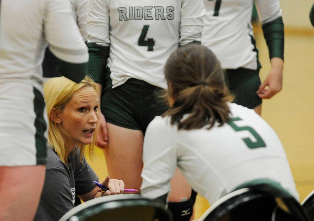 First-year Port Angeles coach Jennifer Reynolds, a Sequim High grad, rallies her team to a five-set win over the Wolves on Sept. 12. Sequim Gazette photo by Michael Dashiell