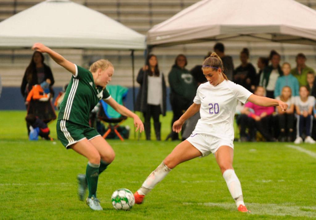 Sequims Jessica Dietzman, center, looks to make a play on the ball as Port Angeles Jada Cargo (20) looks for teammates Bailee Larson (10 and Teagan Clark (4) in the first half of an Olympic League match-up in Port Angeles on Sept. 12. The Roughriders won, 4-1. Sequim Gazette photo by Michael Dashiell