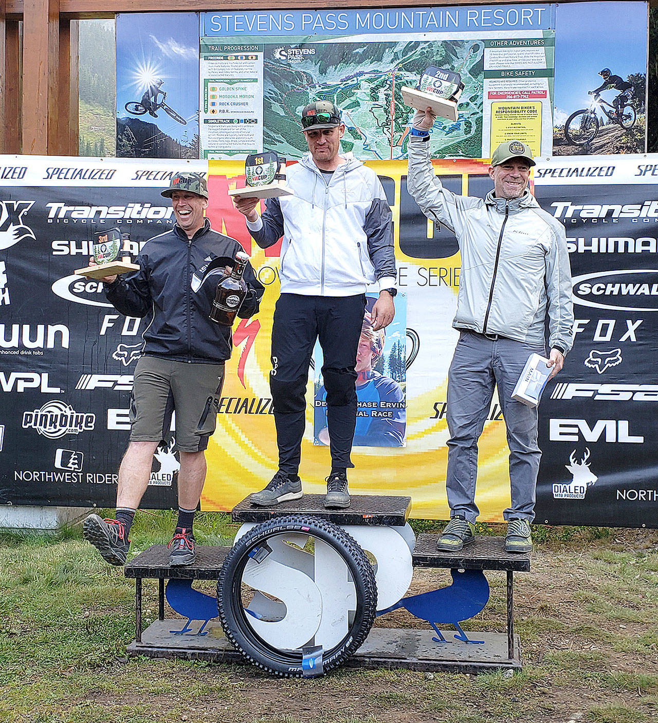 Travis Bear of Sequim, center, won the Northwest Cup championship for the mens Cat 3 40-59 division. Bear had seven top 3 finishes in NW Cup races this spring and summer, dominating his division. Submitted photo