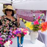 Waan Whitaker of Mai Thai Flowers displays her silk flowers at the Sequim Farmers Market. Photo courtesy of April Hammerand/Sequim Farmers Market