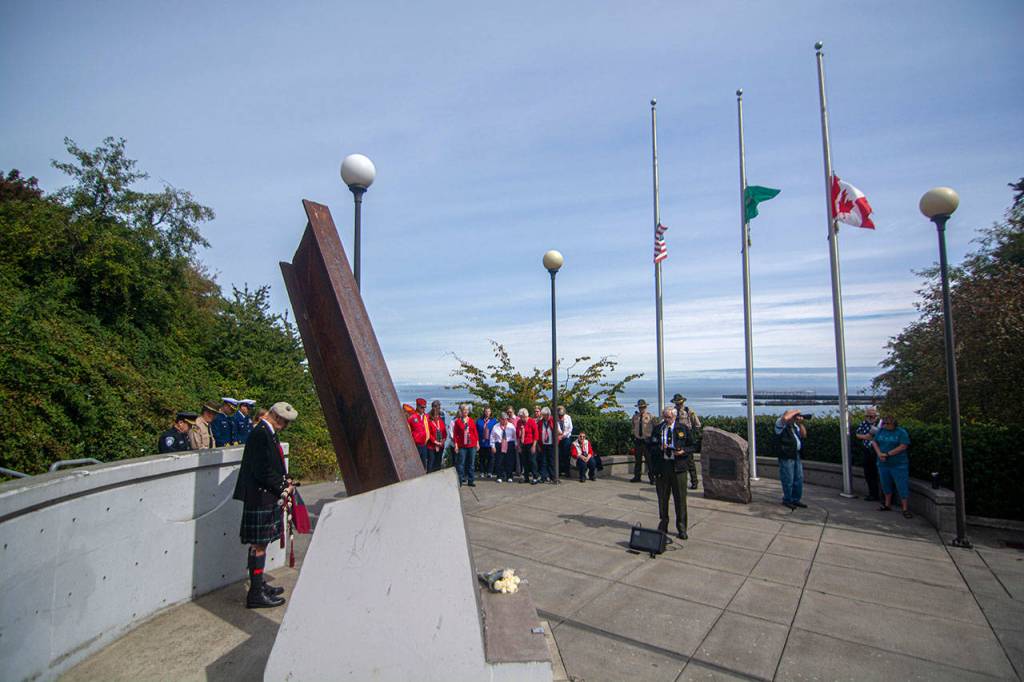 Clallam County Sheriffs Chaplain Ed Evans says a prayer during a ceremony in Port Angeles honoring public safety officials on the 18th anniversary of the 9/11 terrorist attacks Wednesday. (Jesse Major/Peninsula Daily News)                                Clallam County Sheriffs Chaplain Ed Evans says a prayer during a ceremony in Port Angeles honoring public safety officials on the 18th anniversary of the 9/11 terrorist attacks Wednesday. Photos by Jesse Major/Peninsula Daily News