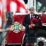 Retired Coast Guardsman Rick McKenzie plays bagpipes outside the Port Angeles Fire Department on the 18th anniversary of the 9/11 terrorist attacks Wednesday. (Jesse Major/Peninsula Daily News)