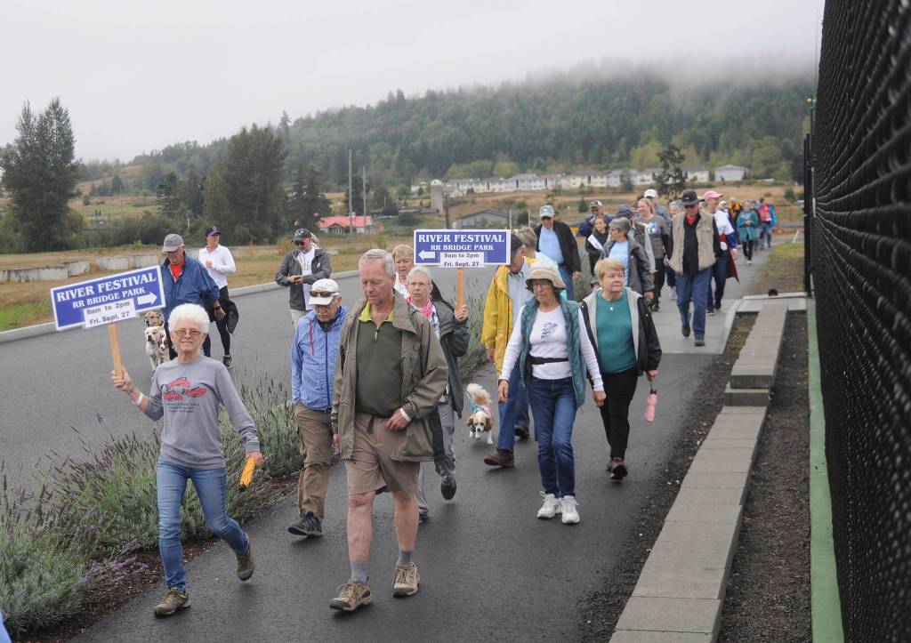 Walkers stroll through Carrie Blake Community Park at the Dungeness Valley Health & Wellness Clinic 2019 Fun Walk and Health Fair on Sept. 14. Sequim Gazette photo by Michael Dashiell