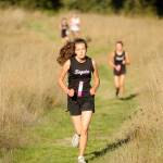 Sequim freshman Anastasia Updike races up Meadow Hill at Robin Hill County Park on Sept. 18. Updike went on to finish fourth overall, completing the hilly, 3.1-mile course in 25:13. Sequim Gazette photo by Michael Dashiell