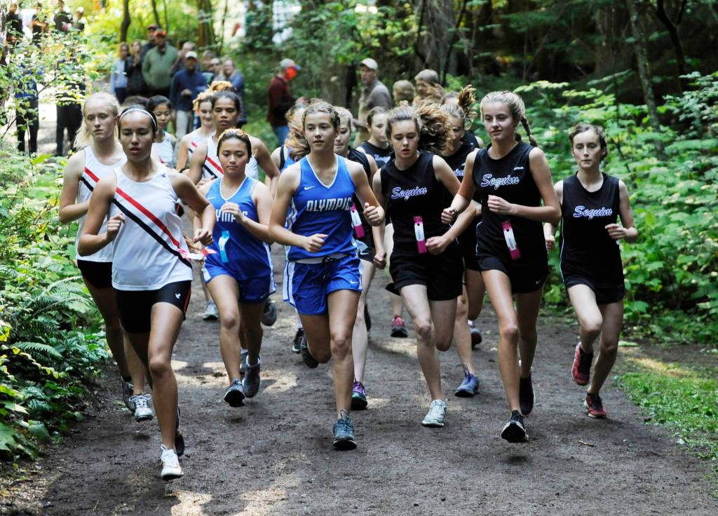 Runners from Port Townsend, Olympic and Sequim break from the starting line at an Olympic League meet at Robin Hill County Park on Sept. 18. Sequims girls edged Port Townsend by a point in the first league meet of the 2019 prep season. Sequim Gazette photo by Michael Dashiell