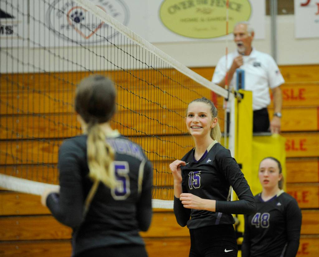 Sequim freshman Kendall Hastings, center, is all smiles in the second game of a three-game sweep of Bremerton on Sept. 17. Also pictured are Amanda Weller, left, and Malory Morey. Sequim Gazette photo by Michael Dashiell