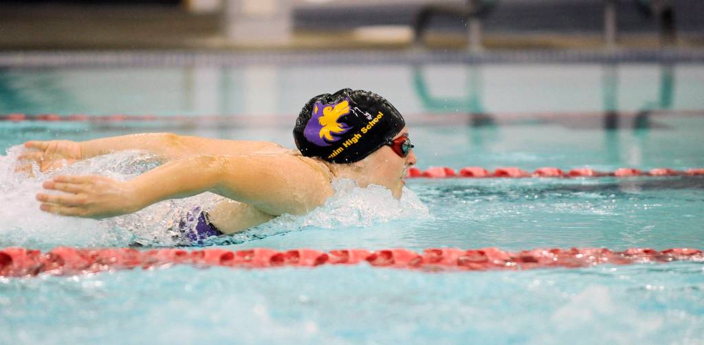 Left, Sequims Lauren Sundin places second overall in the 100 yard butterfly with a 1:22.49 mark in a Sept. 19 league meet against Port Angeles. Sydney Swanson races to a close win  by .35 of a second  in the 100 breaststroke. Swanson posted a district qualifying time (1:20.43) in the event. Sequim Gazette photos by Michael Dashiell