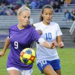 Sequims Eden Johnson, left, vies for the ball with Bremertons Neveah Jackman in an Olympic League match on Sept. 17. Sequim won, 4-1. Sequim Gazette photo by Michael Dashiell