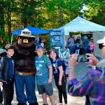 Smokey Bear lines up for a photo for proud grandparent volunteer Mikie Morris at last years Dungeness River Festival. Pictured with Smokey are, from left, Alex Crnic, field ranger for the U.S. Forest Service, Lincoln Terwilliger, Avery Morris, and Sophia Rhynes. Sequim Gazette photo by Matthew Nash