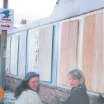 Then-Sequim City Council member Trina Berg, left, stands with artist Kimberly Kopp stand in front of a wall where the Lehmans mural was removed on March 11, 2002. Sequim Gazette file photo by Jeff Chew