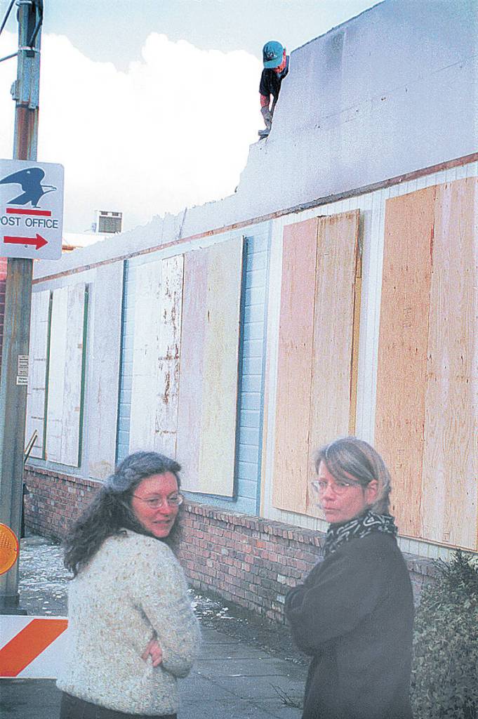 Then-Sequim City Council member Trina Berg, left, stands with artist Kimberly Kopp stand in front of a wall where the Lehmans mural was removed on March 11, 2002. Sequim Gazette file photo by Jeff Chew