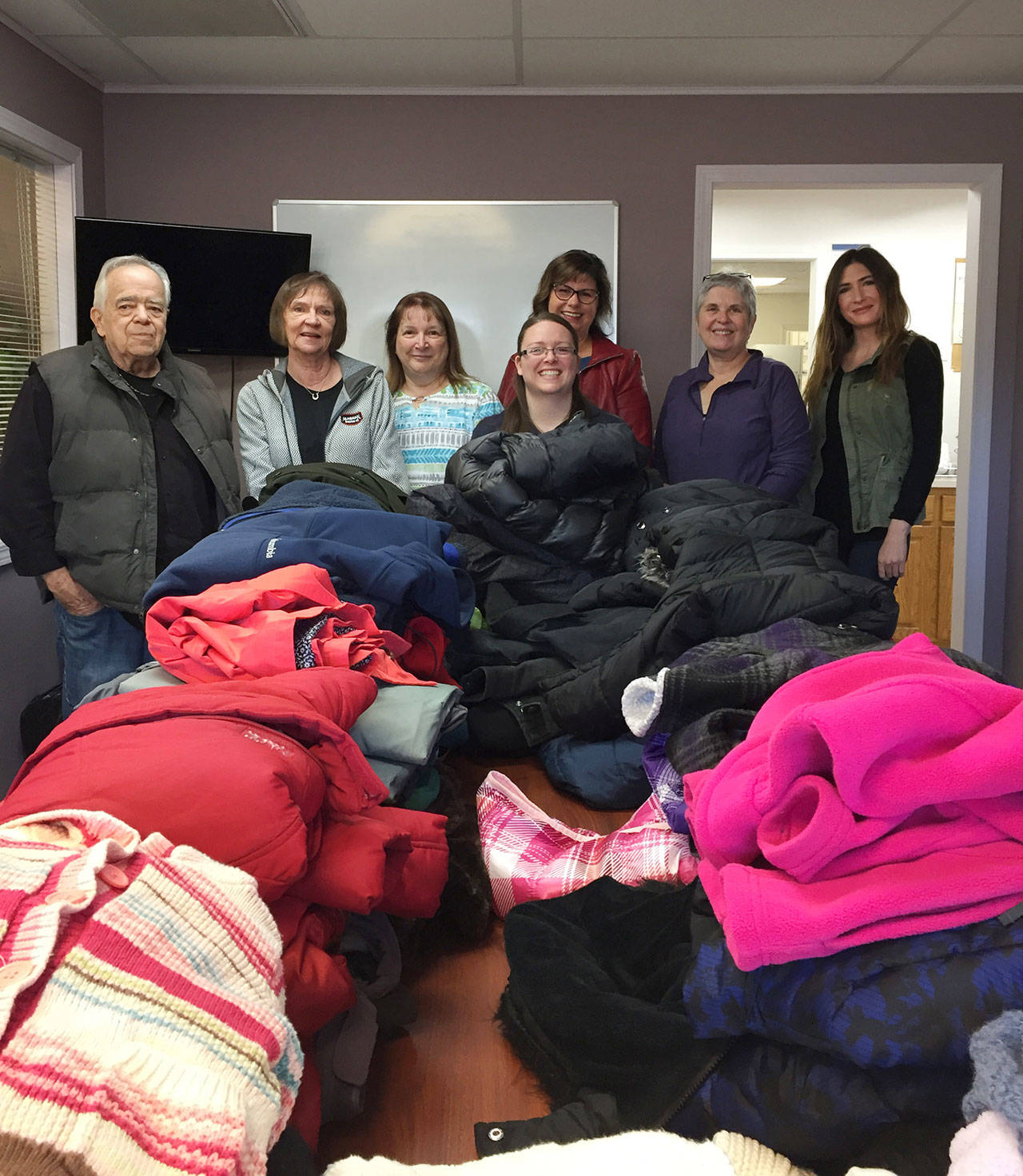 Windermere Real Estate offices in Sequim and Port Angeles are collecting coats this October for those in need. So far they have collected more than 140 coats as well as many hats, gloves and scarves. Their goal: collect 300 coats by the end of the drive on Oct. 31, which will be donated to the Boys & Girls Club and the Sequim Seventh Day Adventists Free Clothing Closet as well as The Answer for Youth (TAFY) in Port Angeles. New or lightly used coats, hats or gloves in any size may be dropped off between 9 a.m.-5 p.m., Monday-Friday at one of two Windermere offices  Windermere Real Estate/Sequim-East, 842 E. Washington St., or Windermere Real Estate/Sunland, 137 Fairway Dr.  or the Windermere Real Estate/Port Angeles office at 711 E. Front St., Port Angeles. Pictured, from left, are Dave Sharman, Carol Dana, Sheryl Payseno Burley, Jessica Warriner, Dianna DaSilva, Madeleine Burns and Kylie Walters of Windermere Real Estate/Sequim-East. Submitted photo
