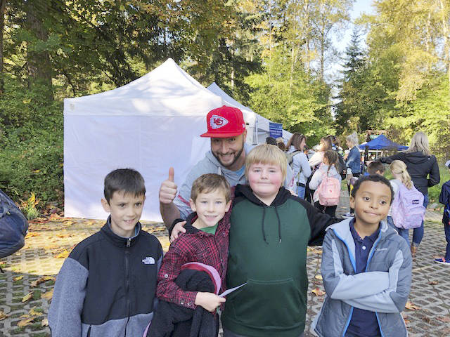 Students in Robert Withrows fourth-grade class  from left, Jacob Webster, Alex Lee, Georgie Bascue (with day George Bascue, in background), and Jerald Stuber  enjoy the River Festival on Sept. 27. Photo courtesy of Donna Hudson/Greywol Elementary School