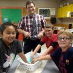 Helen Haller fourth- and fifth-grade students in K-5 STEM specialist Kieth Lees class make slime to conduct an investigation to determine whether the mixing of two or more substances can result in a new substance. Pictured with Lee are, from left, Taylor Thai, Fredrick Wilhelm and Gabriel Francis from Eric Danielsons class. Submitted photo