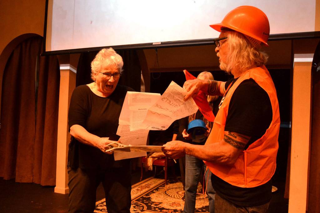 Nick Di Pietro, portraying an inspector, issues Elaine Caldwell notice that they have to shut down the theater during a portion of OTA Moments, a retelling of classic stories in OTAs 40 years. Sequim Gazette photo by Matthew Nash