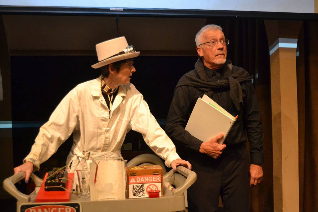 Jaye Butler and Greg Scherer discuss the pyrotechnics of an upcoming show during one of the anecdotes from OTA Moments, running as the second half Oct. 4-13 following War of the Worlds. Sequim Gazette photo by Matthew Nash