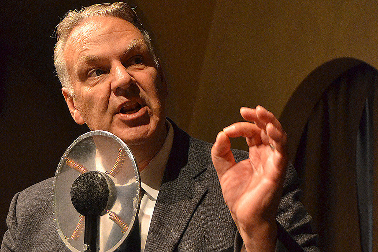 Mark Valentine narrates Orson Welles parts from the radio play War of the Worlds. Director Olivia Shea said they recreate the original play but add more audience interaction and emotion. Sequim Gazette photo by Matthew Nash