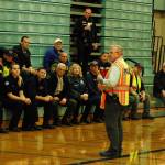 Police sergeant Darrell Nelson briefs the first responders in the Sequim Middle School gym before the Criminal Mass Casualty Incident drill on Sept. 28. Nelson estimated that around 250 people from the dozen agencies involved took part in the drill, more than 100 of which were at SMS including first responders, staff, students, actors and observers.