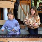 Aliyah Siemion and Lily Tjemsland play marimbas during a performance for Five Acre Schools Soundwaves during the Dungeness River Festival. Sequim Gazette photo by Matthew Nash