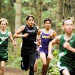 Sequims Kaleb Needoba, second from left, races against North Kitsap and Port Angeles in a Sept. 27 league meet at Robin Hill County Park. Needoba set a 5,000-meter personal best in an Oct. 2 league meet in Belfair. Sequim Gazette file photo by Michael Dashiell