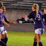 Senior forward Eden Johnson (second from right, no. 9) celebrates with her teammates after scoring Sequims second goal of a 5-0 win over Kingston on Oct. 3. Hanna Wagner (left, no. 14) also scored a goal on the night, and nearly scored three more on an impressive night for the sophomore forward. Sequim Gazette photo by Conor Dowley