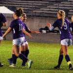 Senior forward Eden Johnson (second from right, no. 9) celebrates with her teammates after scoring Sequims second goal of a 5-0 win over Kingston on Oct. 3. Hanna Wagner (left, no. 14) also scored a goal on the night, and nearly scored three more on an impressive night for the sophomore forward. Sequim Gazette photo by Conor Dowley