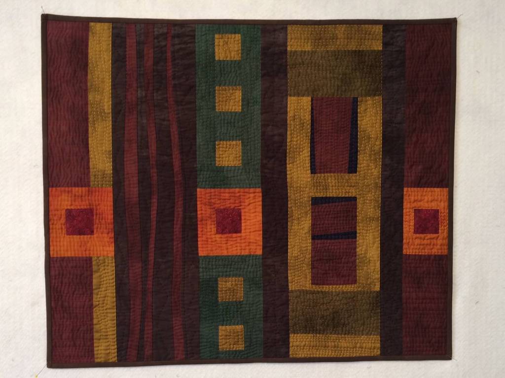 A Walk in the Woods by Stan Green, a featured artist at the fiber arts exhibition Irresistible Aesthetics – Beauty, Absorption, & Ideology at Sequim Museum & Arts. Submitted art