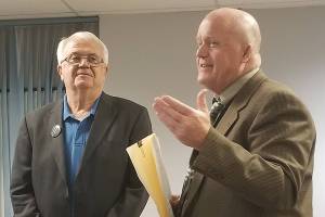 Interim Sequim School District superintendent Rob Clark, right, addresses the audience before swearing in Larry Jeffryes, left, to fill the previously vacant Director District 1 seat on the school board on Oct. 7. Jeffryes was selected to fill the seat in the Sept. 23 board meeting, and is running unopposed for that seat in the Nov. 5 general election. Sequim Gazette photo by Conor Dowley
