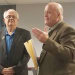 Interim Sequim School District superintendent Rob Clark, right, addresses the audience before swearing in Larry Jeffryes, left, to fill the previously vacant Director District 1 seat on the school board on Oct. 7. Jeffryes was selected to fill the seat in the Sept. 23 board meeting, and is running unopposed for that seat in the Nov. 5 general election. Sequim Gazette photo by Conor Dowley