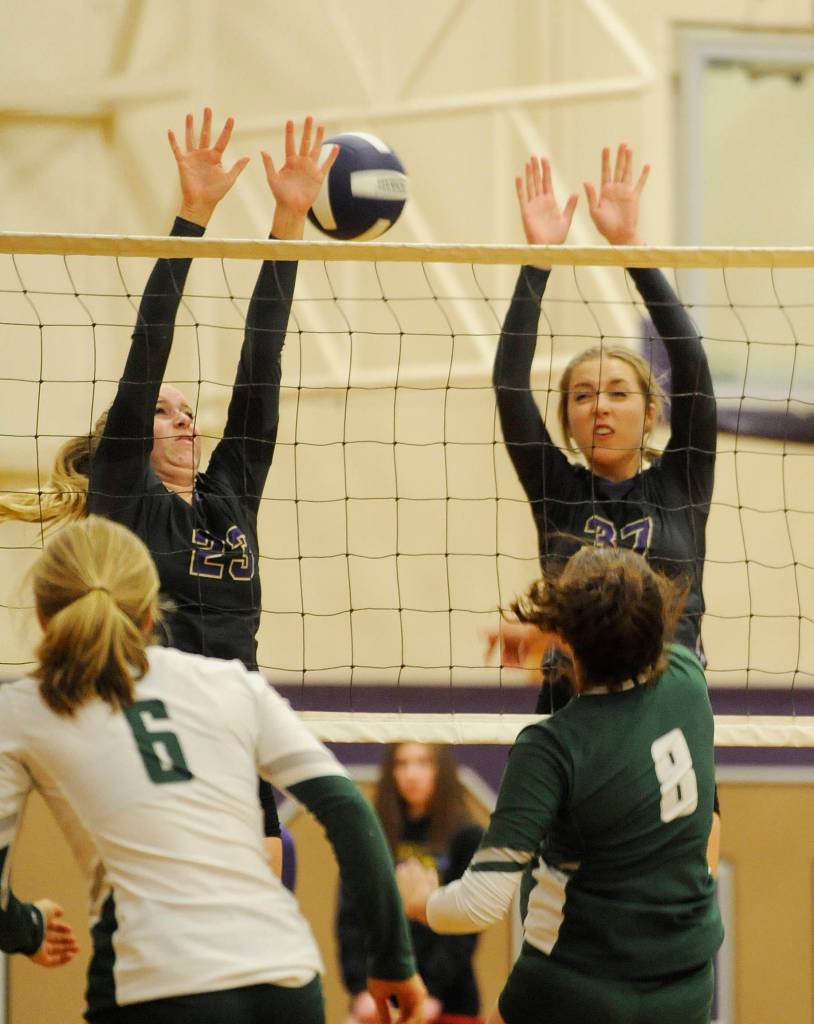 Sequims McKenna Hastings, left, and Liz Daigle look to block a hit from Port Angeles Jaida Wood. Sequim Gazette photo by Michael Dashiell